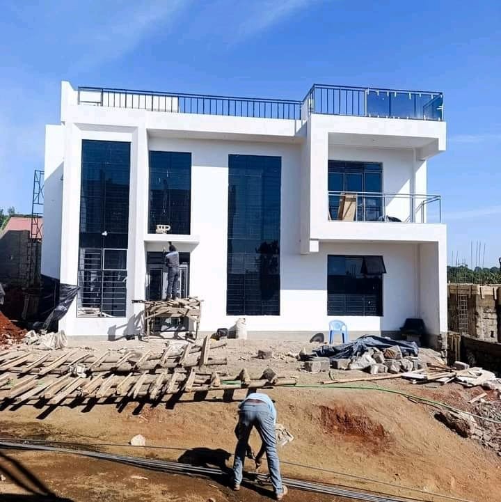 Actuarial Construction Company workers on-site during active construction in Eldoret, Kenya